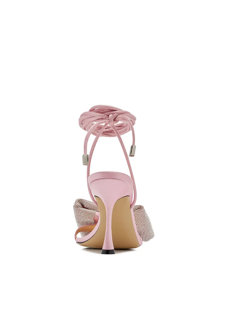 Early spring sandals feature a fine heel, an open toe, and a lace-up- Poli